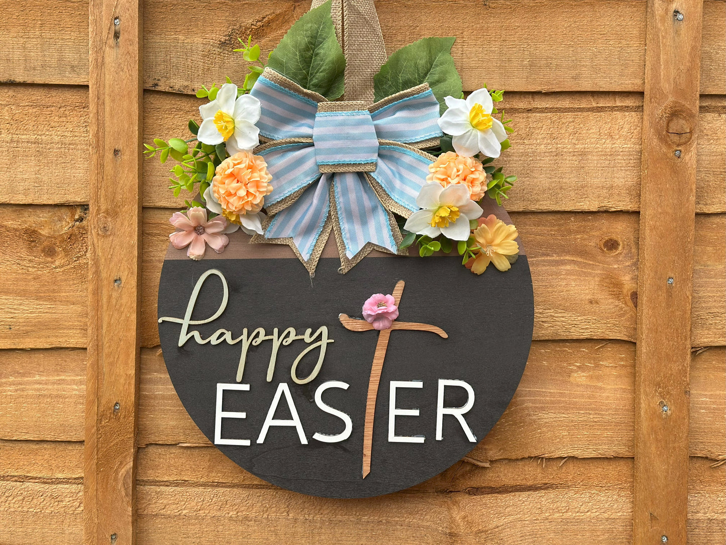 Handmade Easter wreath with artificial flowers and a fabric bow β rustic vintage spring home decor.