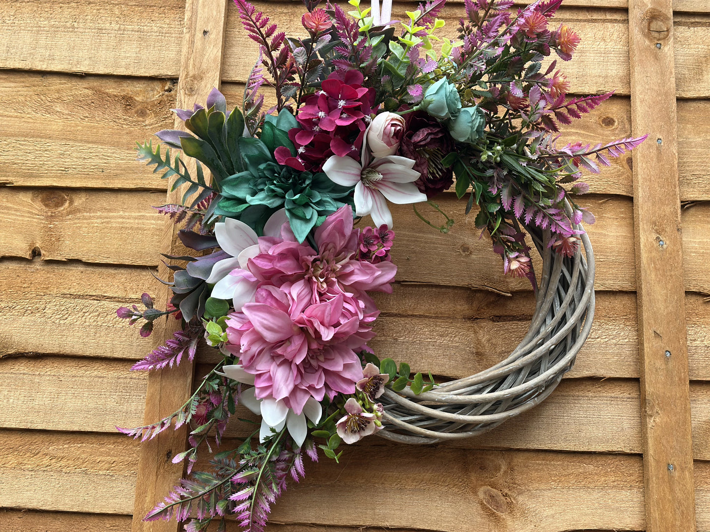 Bold pink, teal, and purple summer-inspired wreath, handcrafted with premium artificial flowers for year-round décor.