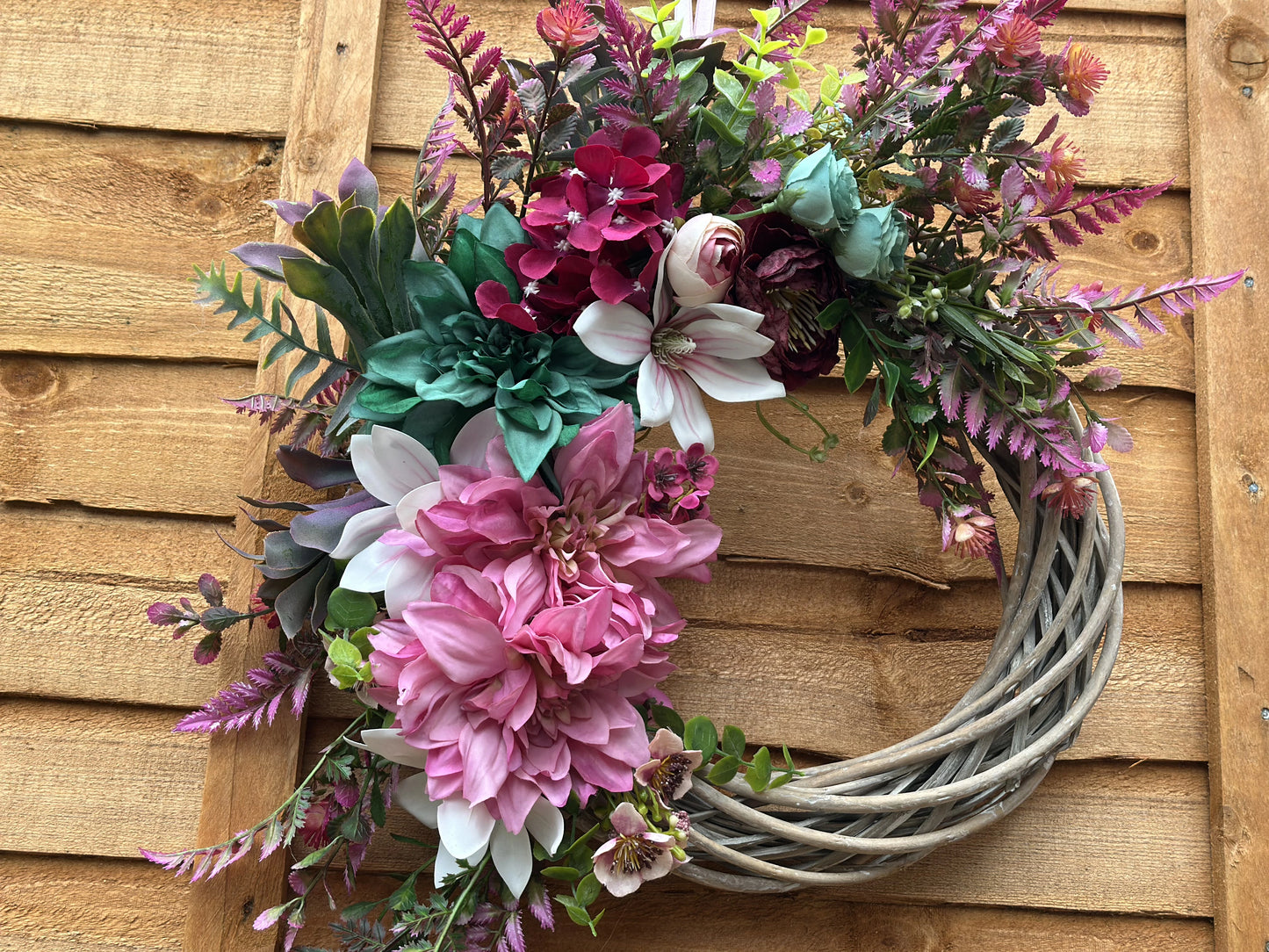 Bold pink, teal, and purple summer-inspired wreath, handcrafted with premium artificial flowers for year-round décor.