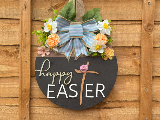 Handmade Easter wreath with artificial flowers and a fabric bow – rustic vintage spring home decor.