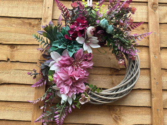 Bold pink, teal, and purple summer-inspired wreath, handcrafted with premium artificial flowers for year-round décor.